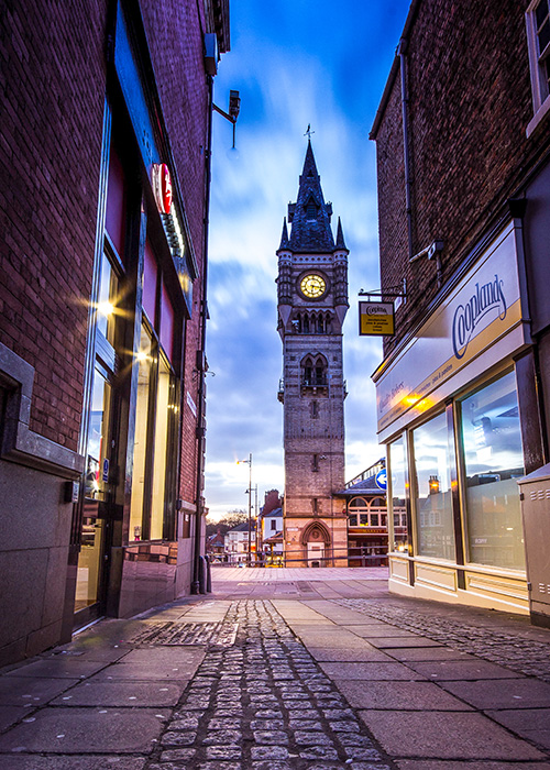 the clock tower taken from a alley