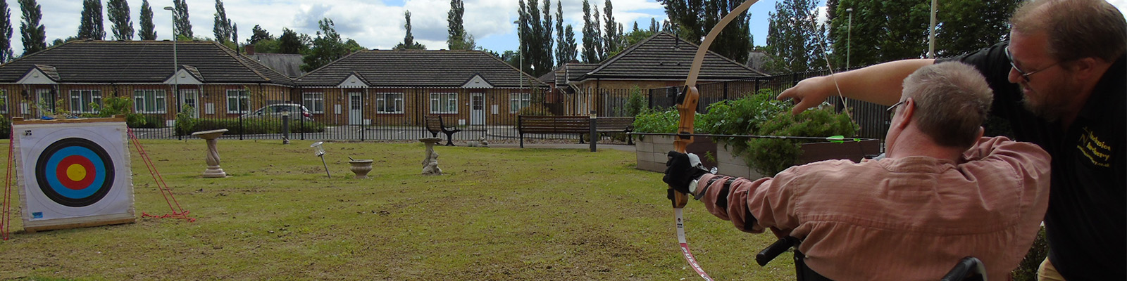 a resident learning archery