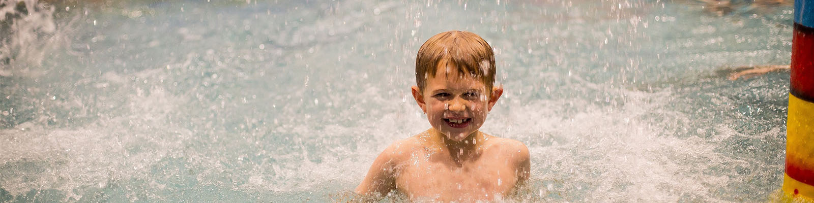 a child enjoying themselves in the pool